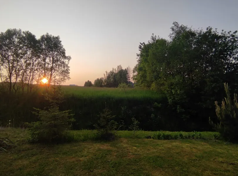 widok na na zachód słońca z tarasu domku Letni Poranek